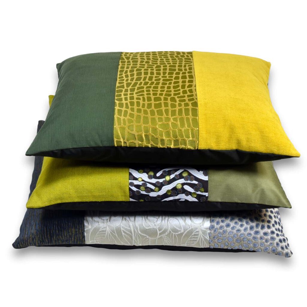 AN-NA Design bietet edle Kissen und besondere Geschenke, Design Manufaktur, handgefertigt in Deutschland. Hier ein Kissen in den Farben Grün und Gelb, zusammen mit weiteren passenden Kissen.